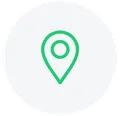 Green location pin icon centered in a white circle.